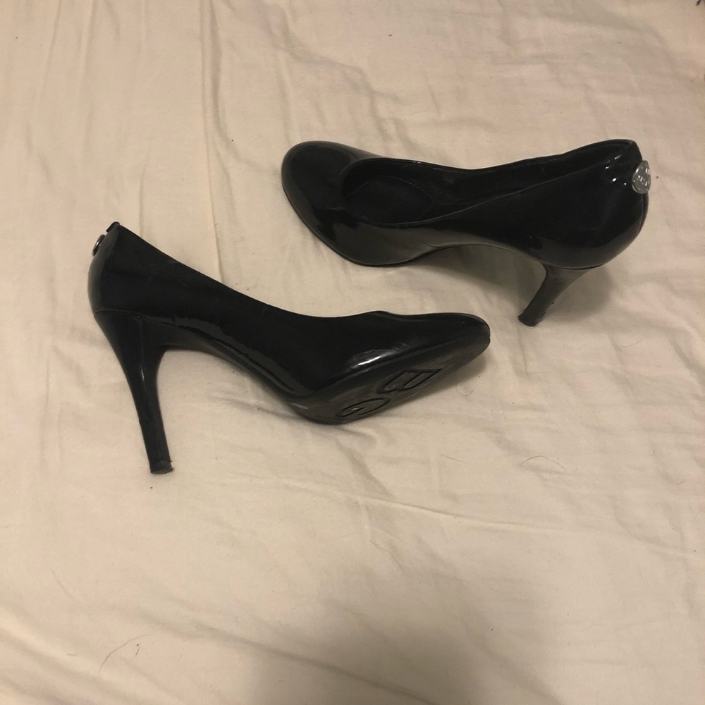 Black closed toe high heels.